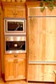 antique larch cabinetry with cappuccino maker