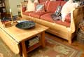 Gateleg coffee table from flooring of a box factory complements our sleigh-style sofa
